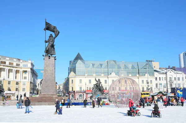 Vladivostok, Russia, January, 6, 2015, People walking on the square of the Fighters of the revolution in Vladivostok in winter