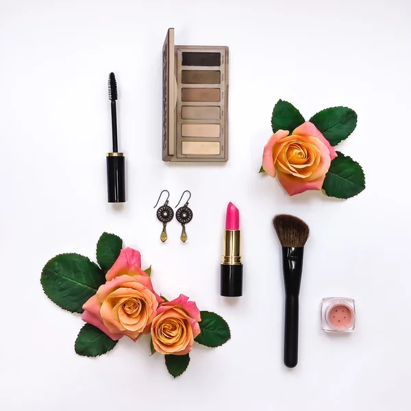 Flat lay composition with make up and essential accessories for woman. Top view