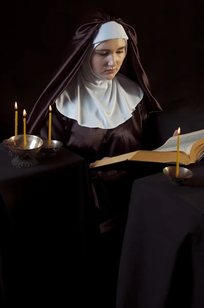 Nun with bible.