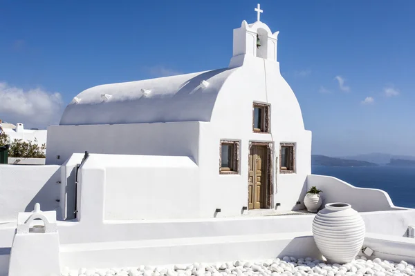 Facade of a white Greek Orthodox family chapel in Oia (Ia) on the island of Santorini (Thera) - Cyclades - in Greece - Europe