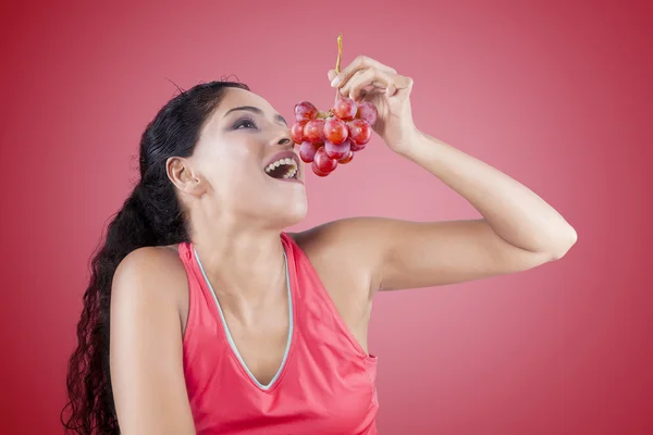 Indian Woman Eating Grapes