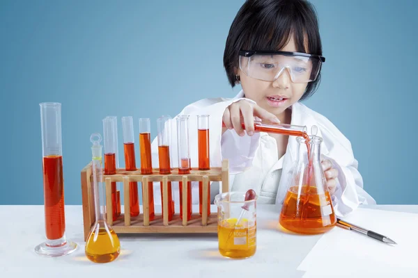 Scientist mixing the chemical fluid