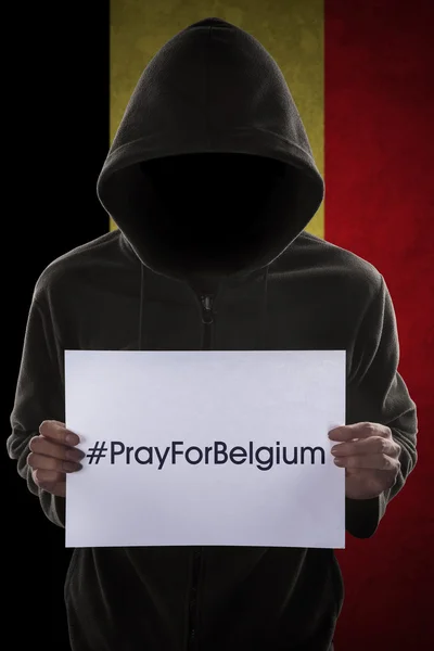 Man with text to pray for Belgium