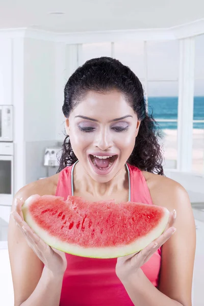 Female model enjoy slice of watermelon