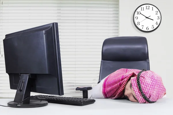 Muslim businessman sleeping in office