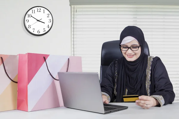 Arabic young worker shopping online