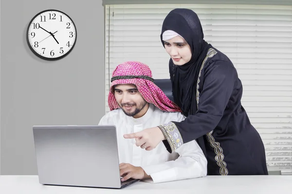 Arabic couple working together