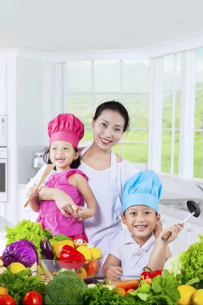 Happy family preparing a meal