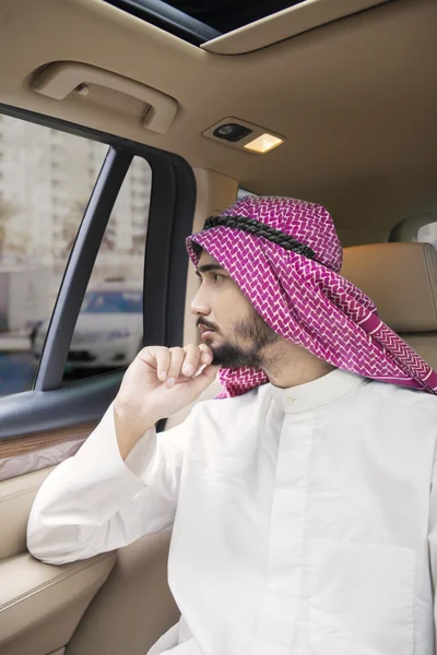 Arabian entrepreneur thinking idea in car