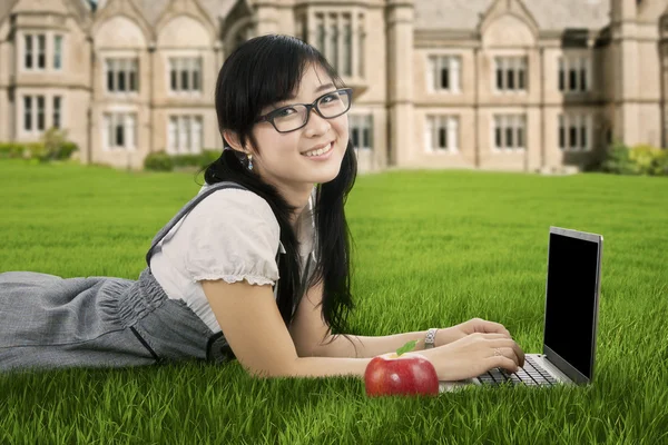 Chinese student studying at the park