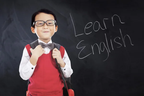 Schoolboy with text Learn English