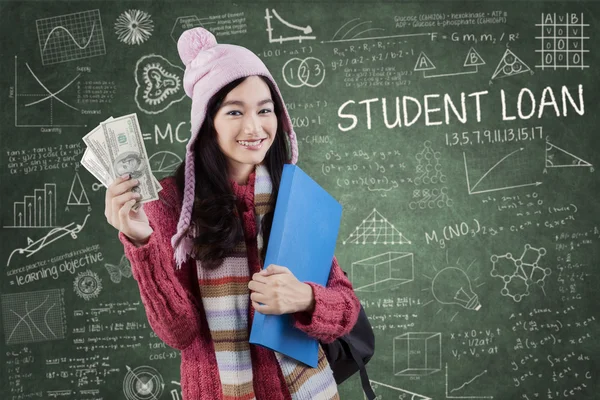 College girl with money in class