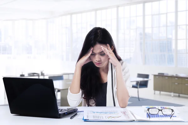 Frustrated businesswoman working in office