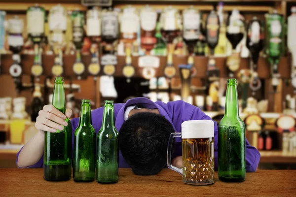 Male alcoholic in the bar