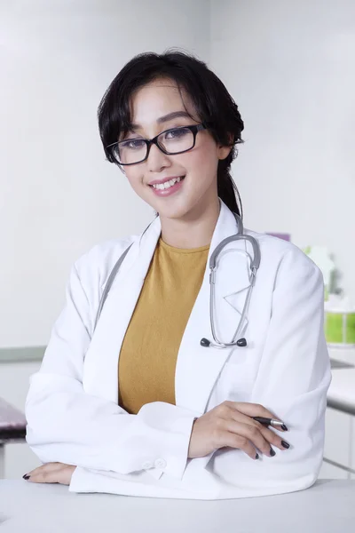 Friendly female doctor in the clinic