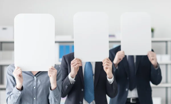 Business people holding a white signs