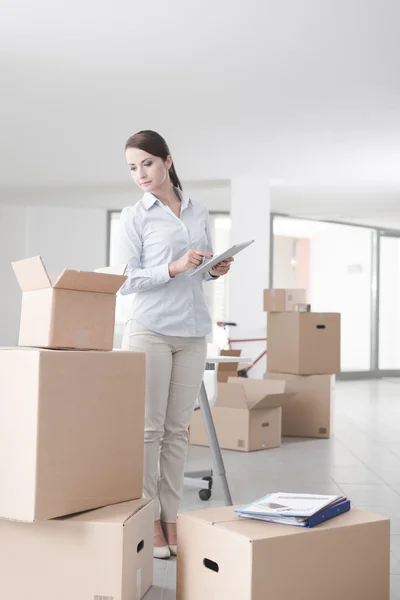 Businesswoman moving in her new office