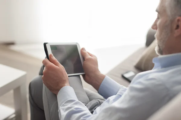 Man using a touch screen tablet