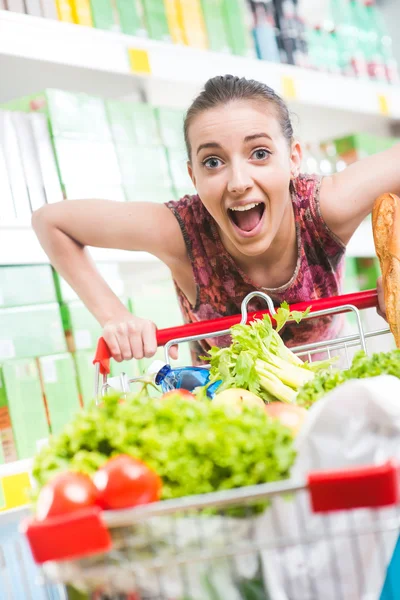 Full shopping cart at supermarket