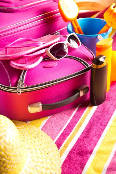 Striped colorful towel with pink bag