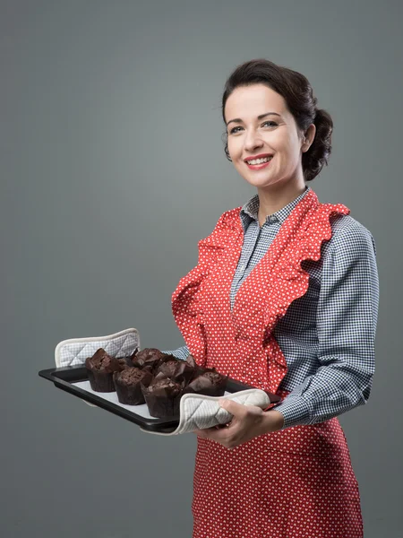 Vintage housewife with muffins