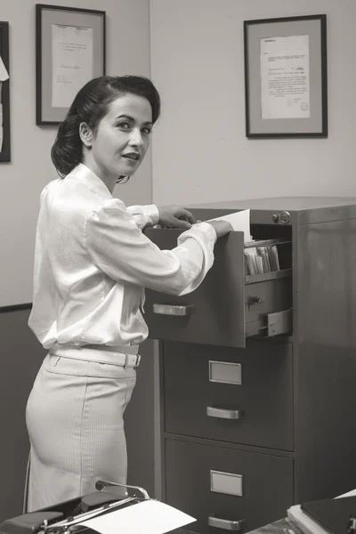 Secretary searching files