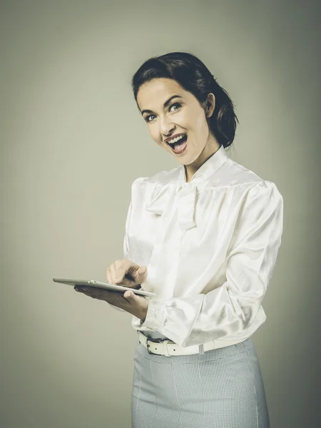 Excited vintage woman with tablet