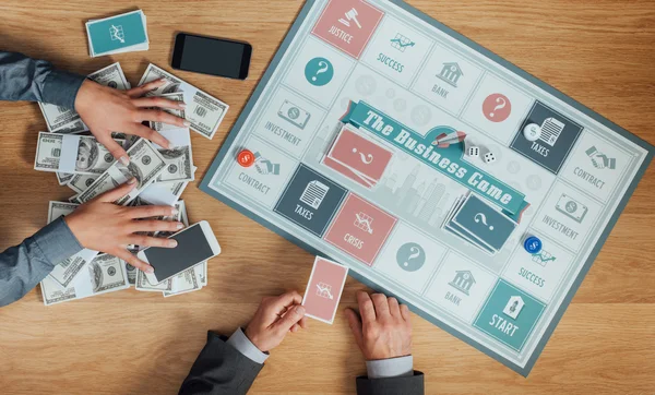 People playing the business board game