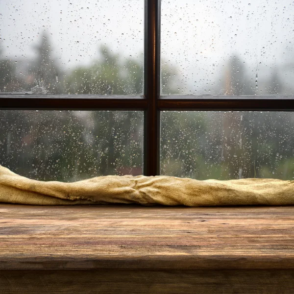 Empty table near the rainy window