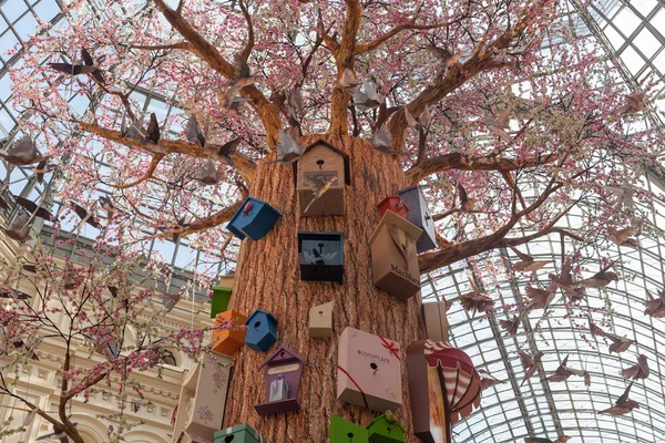 Artificial tree, birds and birdhouses at GUM store