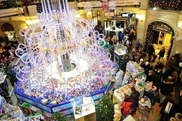 Christmas fair, illumination and buyers in GUM store