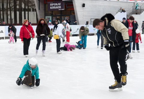 Citizens resting on winter ice rink