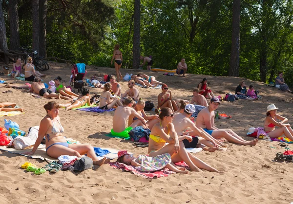 People sunbathing in Moskva river beach at Serebryany Bor