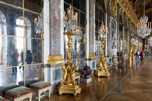 Visitors admiring the Hall of Mirrors Palace Versailles near Paris, France