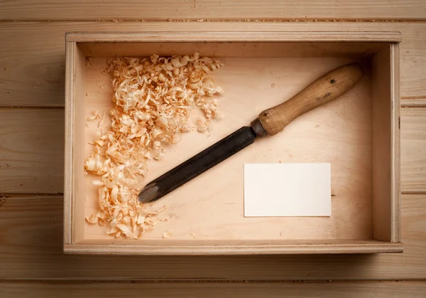 Carpenter tools in wooden box and business card