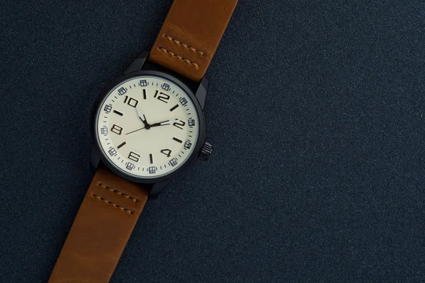 Luxury mens watch made of black high-tech ceramics. Close-up studio photo with selective focus