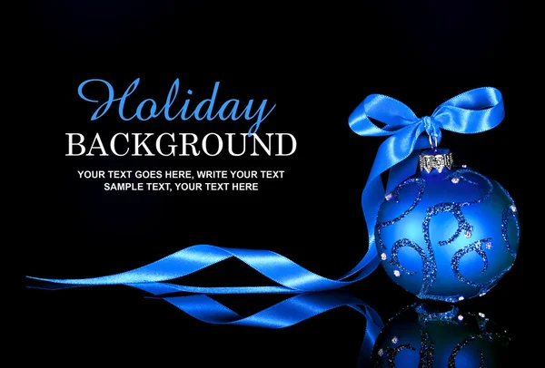 Christmas background with blue ornament and ribbon