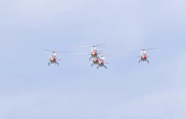 Helicopters in sky