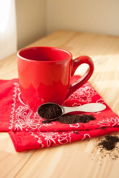 Red Coffee Mug with Napkin and Grounds