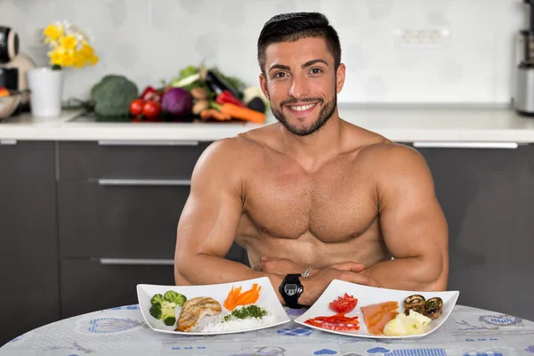 Young bodybuilder in the kitchen