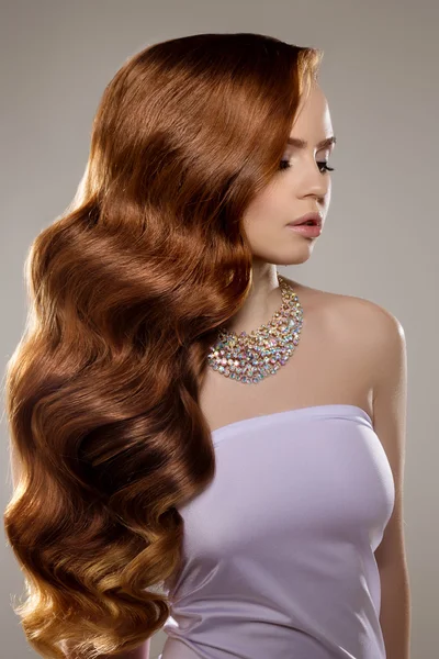 Model with long red hair. Waves Curls Hairstyle. Hair Salon. Upd