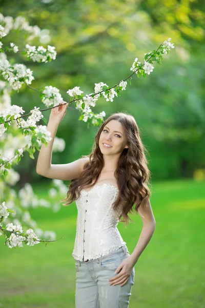 Young spring fashion woman in spring garden Springtime Summertim