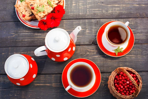 Tea cups top view. Tea time for party. Tea set red polka-dot, co