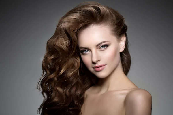 Model with long hair. Waves Curls Hairstyle. Hair Salon. Updo. F