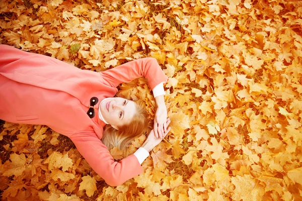 Autumn woman on background fall landscape leaves of trees. Model