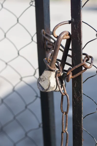 Chain link fence and metal door with lock