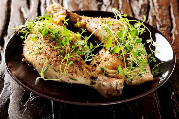 Grilled spicy chicken legs with herbs