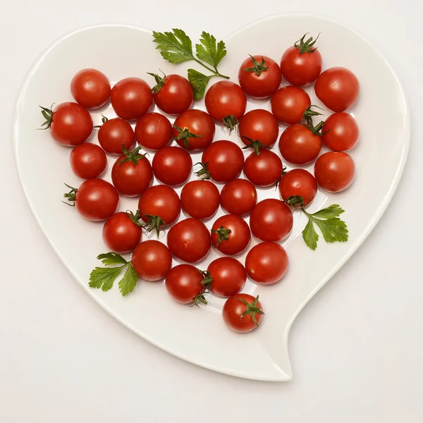 Heart shaped plate and tomatoes