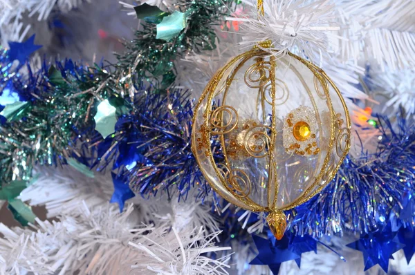 Tree, christmas balls and tinsel