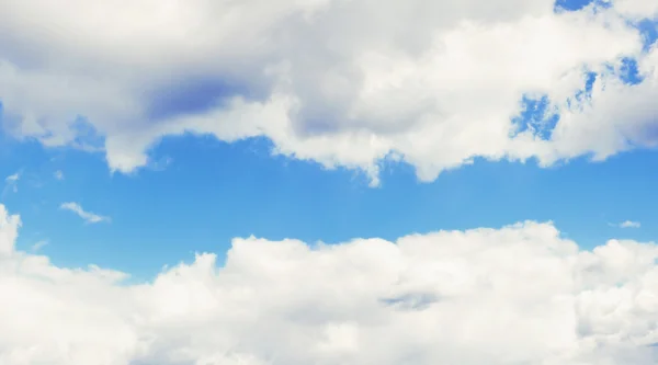 Blue sky, clouds and sun light. Summer, spring background